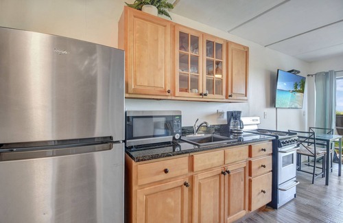 Crescent Beach Condo | Ocean Front Condo With Heated Pool outdoor patio overlooking the Ocean
