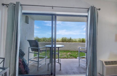 Crescent Beach Condo | Ocean Front Condo With Heated Pool outdoor patio overlooking the Ocean