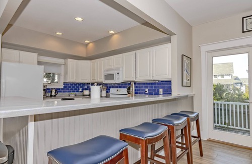 South Beach House | Ocean front duplex with master balcony overlooking the beach; newer six passenger golf cart