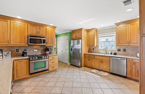 Ocean Isle Beach House | OIB Canal Home - GREAT outdoor - under house & screen porch, LARGE kitchen, DOCK