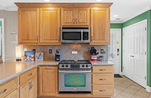 Ocean Isle Beach House | OIB Canal Home - GREAT outdoor - under house & screen porch, LARGE kitchen, DOCK