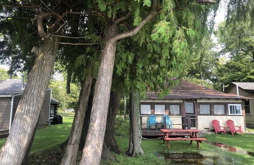 Traverse City House | One-bedroom cabin on Lake Leelanau. Sunset view. Dog considered.