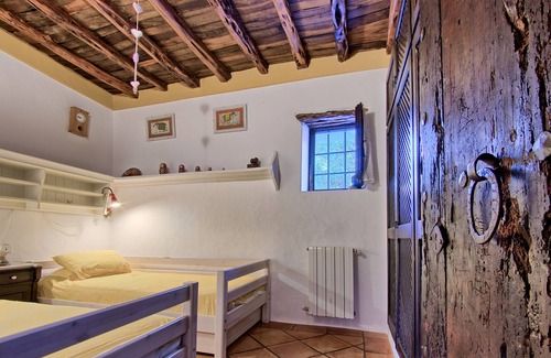 Sant Miquel de Balasant Villa | Original restored stone-wood ibizan country villa with pool facing sunset.