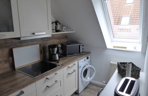Wulfen Apartment | Ostseebrise-Fehmarn - time out by the sea, with a country-style fireplace, 400 m to the sea