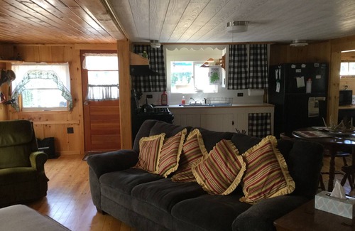 North New Portland Cottage | Paddle, float, fish, or rope swing into the near by crystal clear mountain lake.