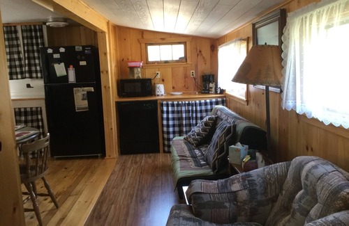 North New Portland Cottage | Paddle, float, fish, or rope swing into the near by crystal clear mountain lake.