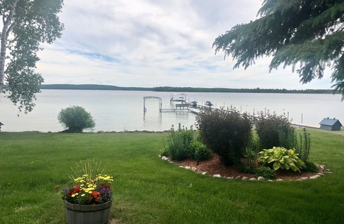 Brutus House | Palmer's Burt Lake Cottage - Private Dock! Waterfront!