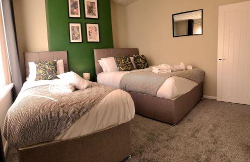 Port Talbot Apartment | Parking, 4 Bedrooms, Small Courtyard