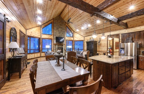 Broken Bow Cabin | Patio in the Pines offers all of the luxuries in an absolutely stunning vacation cabin. One of the outstanding features is a HUGE 1,200 square foot covered outdoor living space with soaring ceilings, adorned with a wine barrel chandelier.