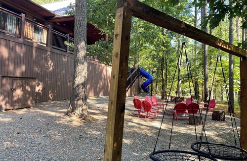 Broken Bow Cabin | Patio in the Pines offers all of the luxuries in an absolutely stunning vacation cabin. One of the outstanding features is a HUGE 1,200 square foot covered outdoor living space with soaring ceilings, adorned with a wine barrel chandelier.