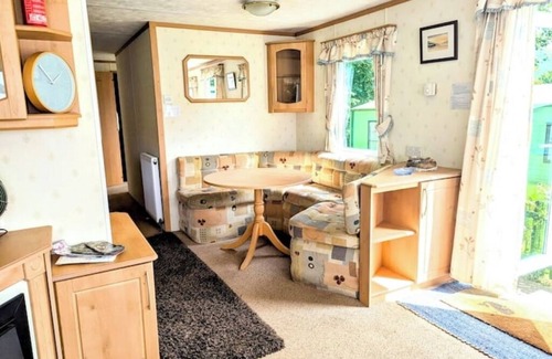 Bryn-crug House | Peaceful, woodland caravan site with pool and bar