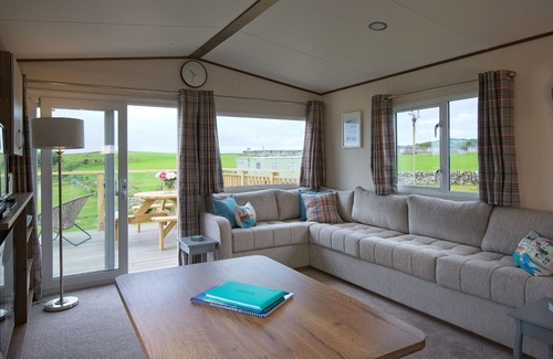 Castle Douglas Cottage | Pebbles - a static caravan that sleeps 6 guests in 3 bedrooms