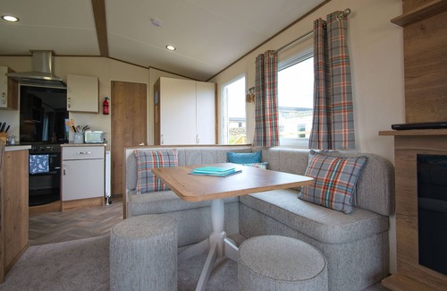 Castle Douglas Cottage | Pebbles - a static caravan that sleeps 6 guests in 3 bedrooms