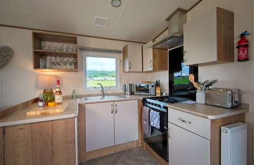 Castle Douglas Cottage | Pebbles - a static caravan that sleeps 6 guests in 3 bedrooms