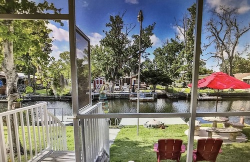 Weeki Wachee Gardens House | PIRATES COVE - Bikes, Kayaks, Outdoor Grill, Boat Dock, and more included.