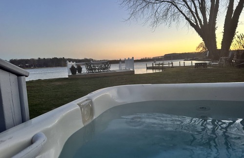Norton Shores House | PONTOON BOAT NOW INCLUDED! KAYAKS! Waterfront Cottage on Mona Lake with HOT TUB!