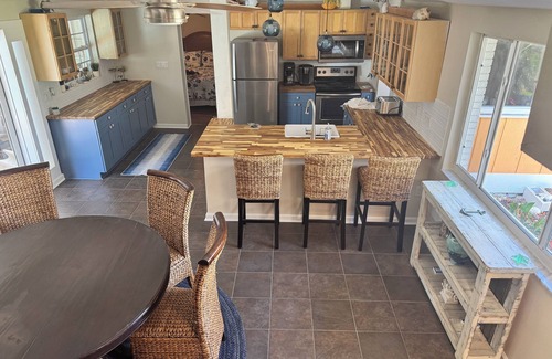 Englewood House | Pool home on canal, 7 min to beach, 1 block to boat ramp, walk to Dearborn St!