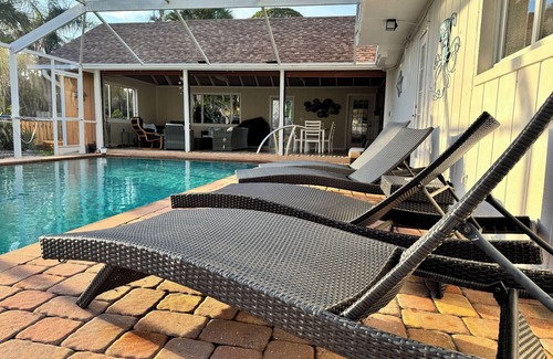 Englewood House | Pool home on canal, 7 min to beach, 1 block to boat ramp, walk to Dearborn St!