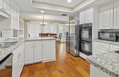 Lake Charles House | Pool table, ample patio, bbq and located in a central neighborhood.