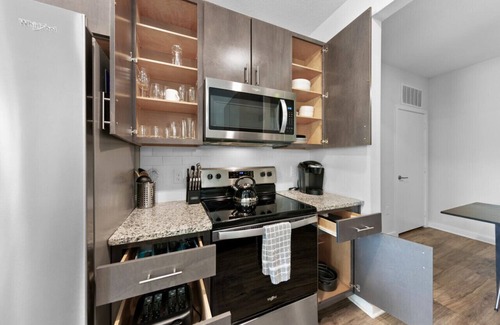 Deerwood Apartment | Poolside Bliss: Stylish 1BR Unit in Resort Complex