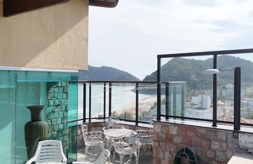 Guaiuba Apartment | Praia do Tombo Guarujá Coverage - Right on the sand, the best comfort for your family