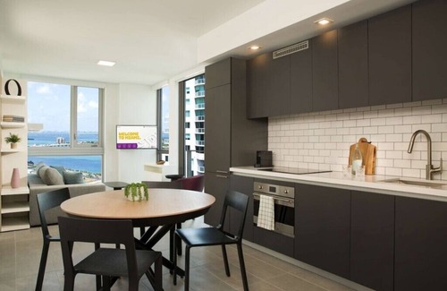 Downtown Miami Condo | Private balcony with panoramic views of Downtown Miami and Biscayne Bay.