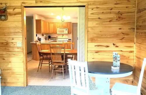 Grand Rapids Cabin | Private cabin in the woods near a serene creek and towering pine trees.