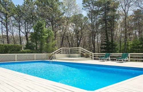 Wainscott Woods House | Private Hamptons vacation home, set on an acre of land, entertainer’s...
