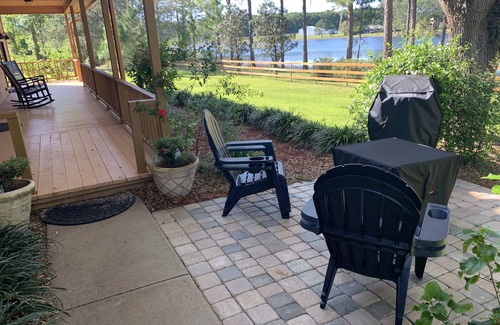 Crescent City Cabin | Private lakeside cabin with fire pit, GAME ROOM, kayaks.