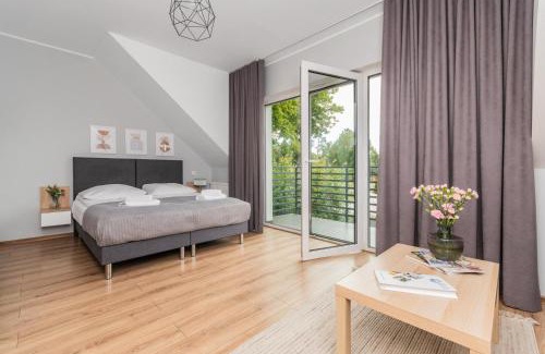 Jantar House | Przystanek Jantar - pokoje i apartamenty