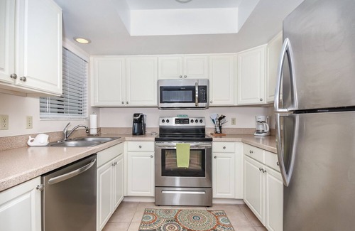 New Smyrna Beach Condo | Quaint 2 bedroom 2 bath villa Walking distance to the car free beach. S4358