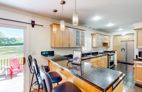 Tucker House | Quiet home in a convenient location with large yard, patio, & fireplace