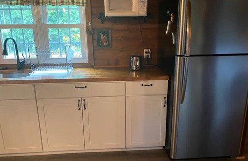 Paw Paw Cabin | Quiet Log Cabin with private river access and hot tub