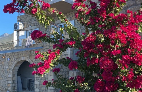 Lefktron House | Rapunzel's tower stone house with incredible 180° sea view 5min drive to the beach