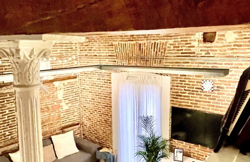 Atocha Apartment | Red brick loft sleeps 6-8 Lavapies Heart