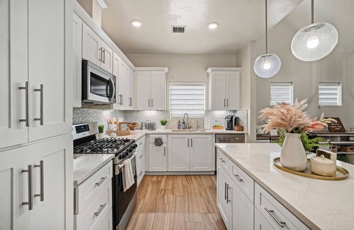 El Paso House | Relax and recharge in this stylish West El Paso home featuring a spacious king suite, dedicated workspace, and a private fenced backyard with BBQ grill and outdoor seating. Just minutes from shopping, dining, and hiking trails, it’s the perfect stay!