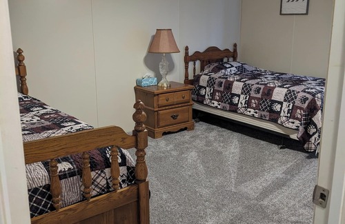 Bluford House | Relax at Woodland Country Lodging, surrounded by the beauty of nature.