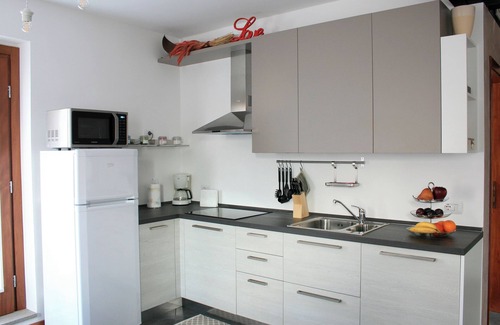 Faedis Apartment | Relax by the pool, pamper yourself in the wellness, sip a good local wine