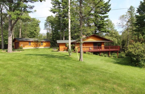 Grayling House | Relax, Unwind and Enjoy. Rustic log cabin with private Au Sable River Frontage!
