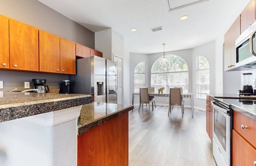 Crystal Cove House | Relaxing Florida getaway with an enclosed pool, grill, game room, & central AC