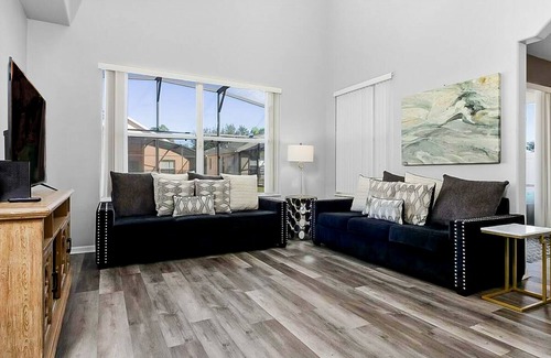 Crystal Cove House | Relaxing Florida getaway with an enclosed pool, grill, game room, & central AC