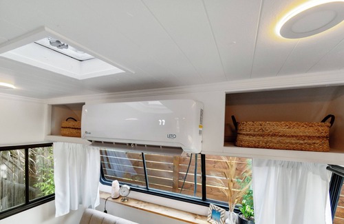 Navy Point House | Renovated 1970’s retro camper on Bayou Grande in Pensacola with walking trail.