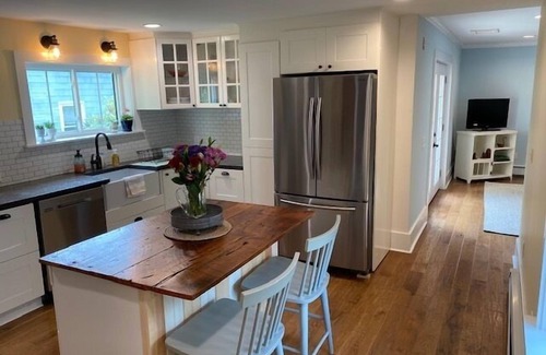 Kennebunk House | Renovated farmhouse featuring two connected rental units with an interior access door. Large Yard