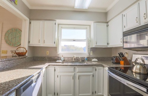 Pelican Bay House | Renovated Home w/Lagoon Views, Screened Porch, Deck & Community Pool; 5 Minute Walk to Beach!