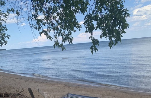 Menominee Cottage | Reserve for Spring and Summer 2023 to enjoy the SAND beach on Green Bay.