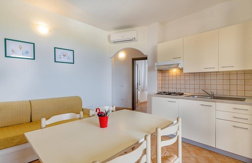 Tergu Apartment | Residenza Le Farfalle 'A' with Garden View, Wi-Fi and Air Conditioning