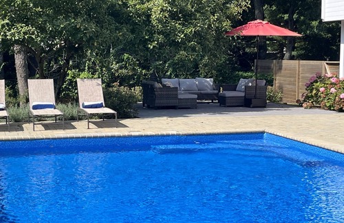 East Quogue House | Resort-like home with NEW KITCHEN, private tennis court, heated pool, & hot tub