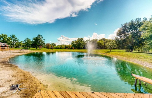 Waller House | Resort-Style Oasis with Swimming Pond, Beach, Tropical Hut & Bar