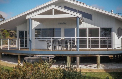 Lake Wangary House | Rest A Shore is a waterfront property with spacious living and north facing panoramic view over the bay from the front deck.