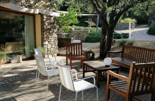 Aglientu Apartment | Room 'Tarzan Jane' with Shared Pool, Private Terrace and Air Conditioning